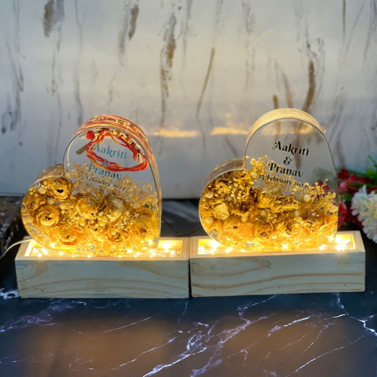 two heart-shaped varmala preservation frame with wooden LED stand