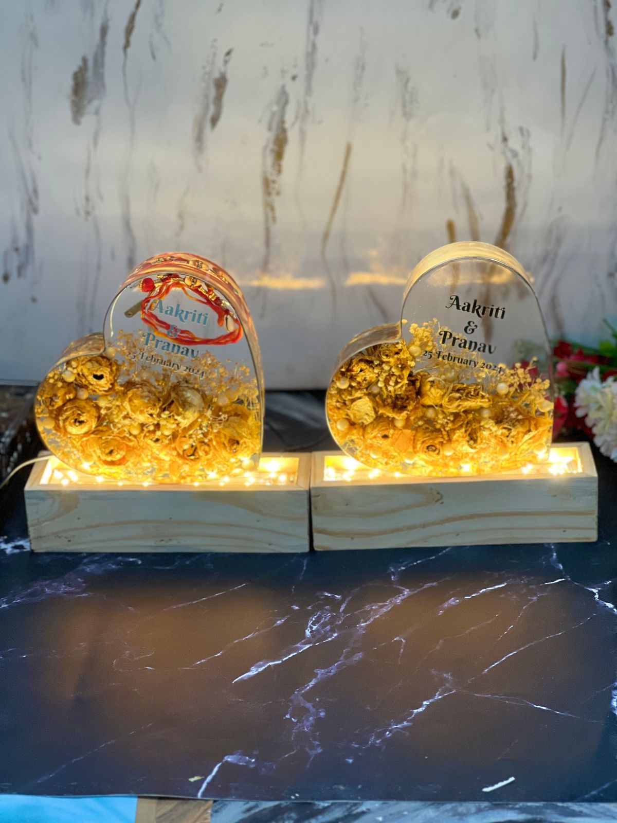 two heart-shaped varmala preservation frame with wooden LED stand