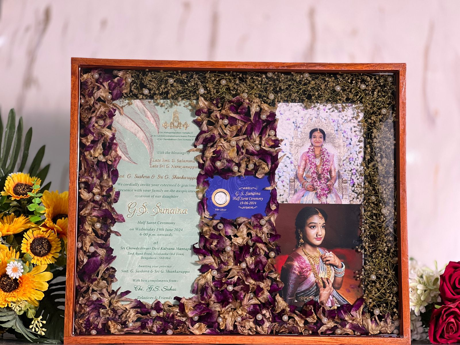 Teakwood frame with preserving wedding garland, photo and card