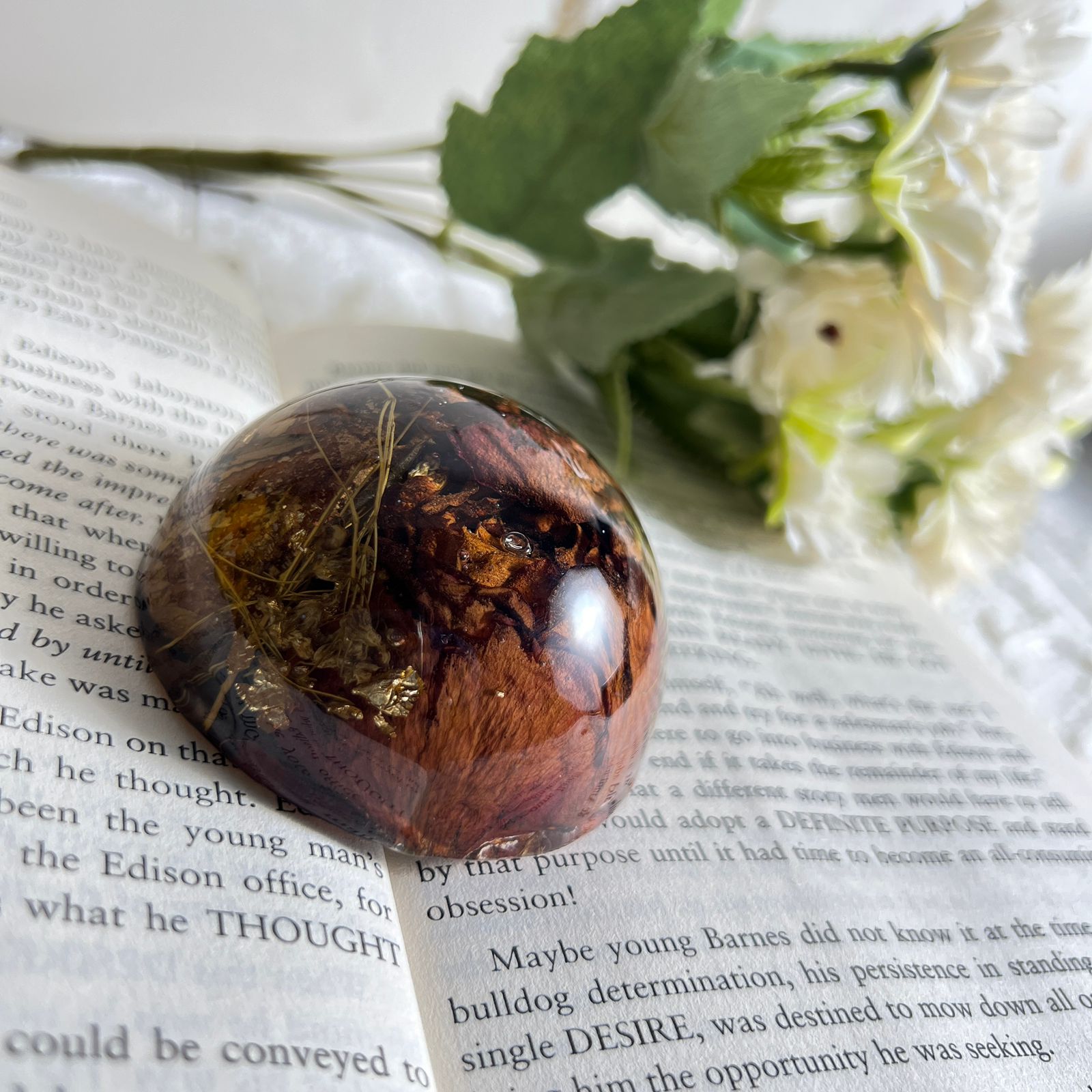 Red rose preserved in resin paperweight