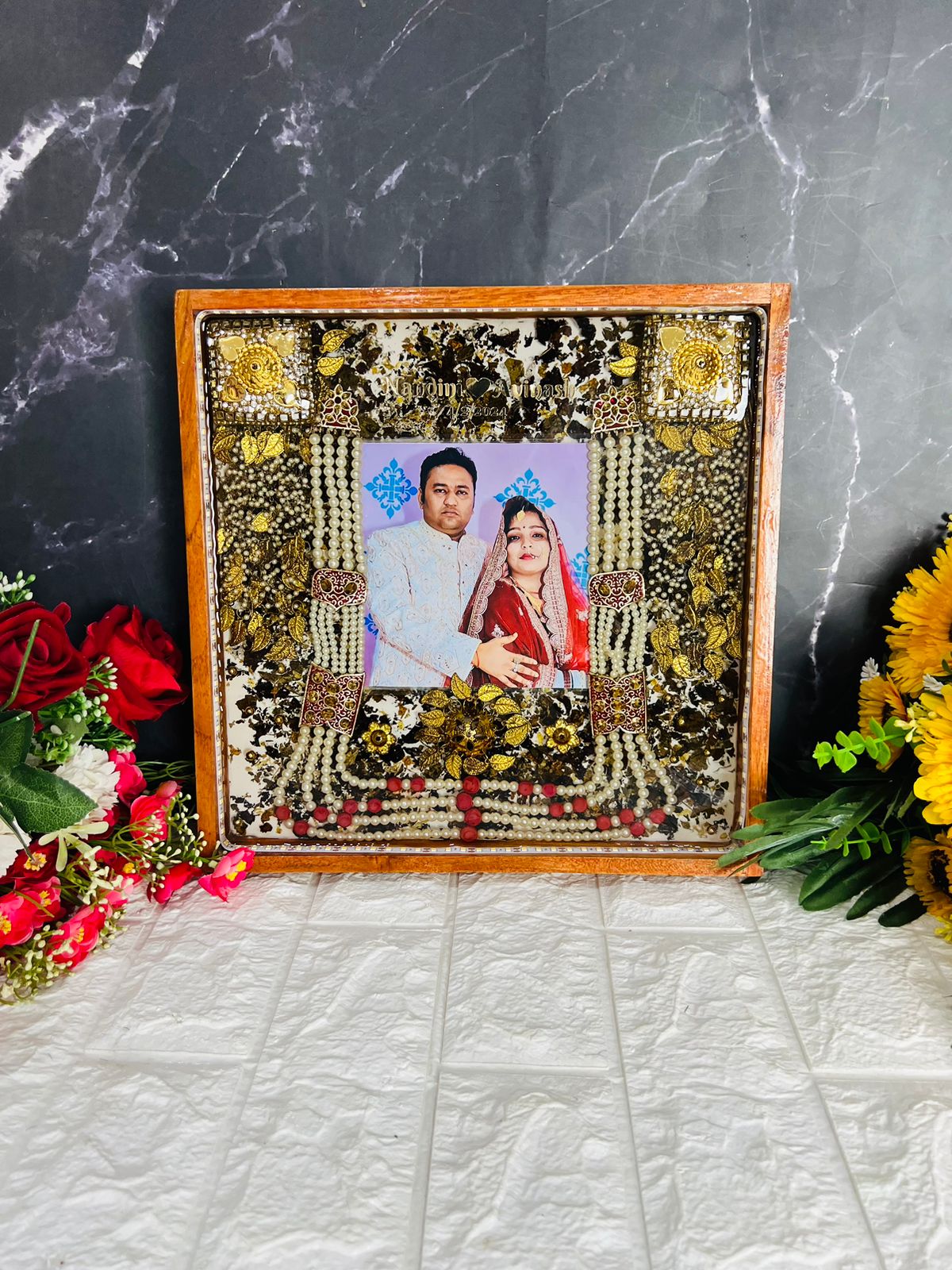 Square teakwood frame with wedding varmala and photo