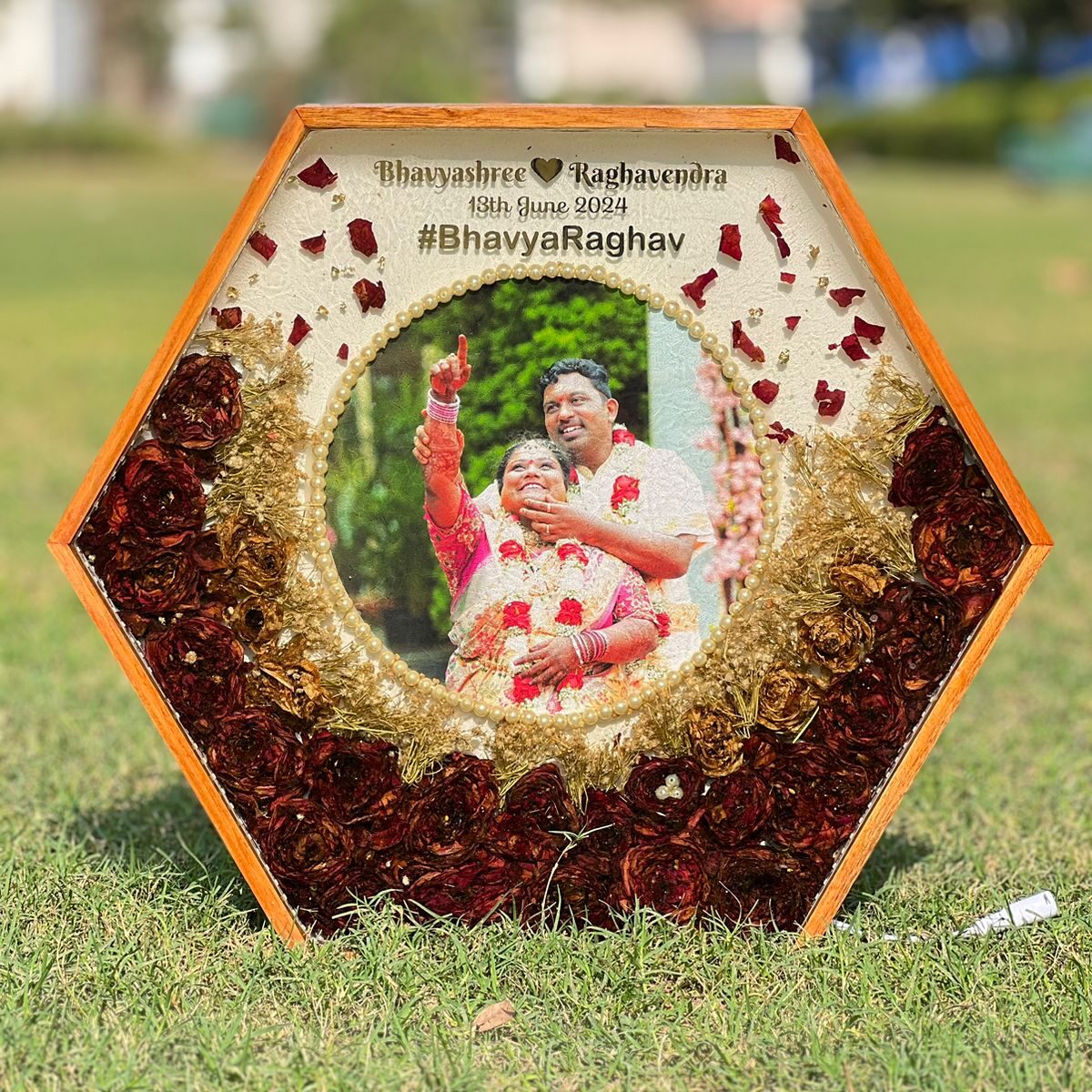 Hexagonal teakwood frame with wedding garland preservation