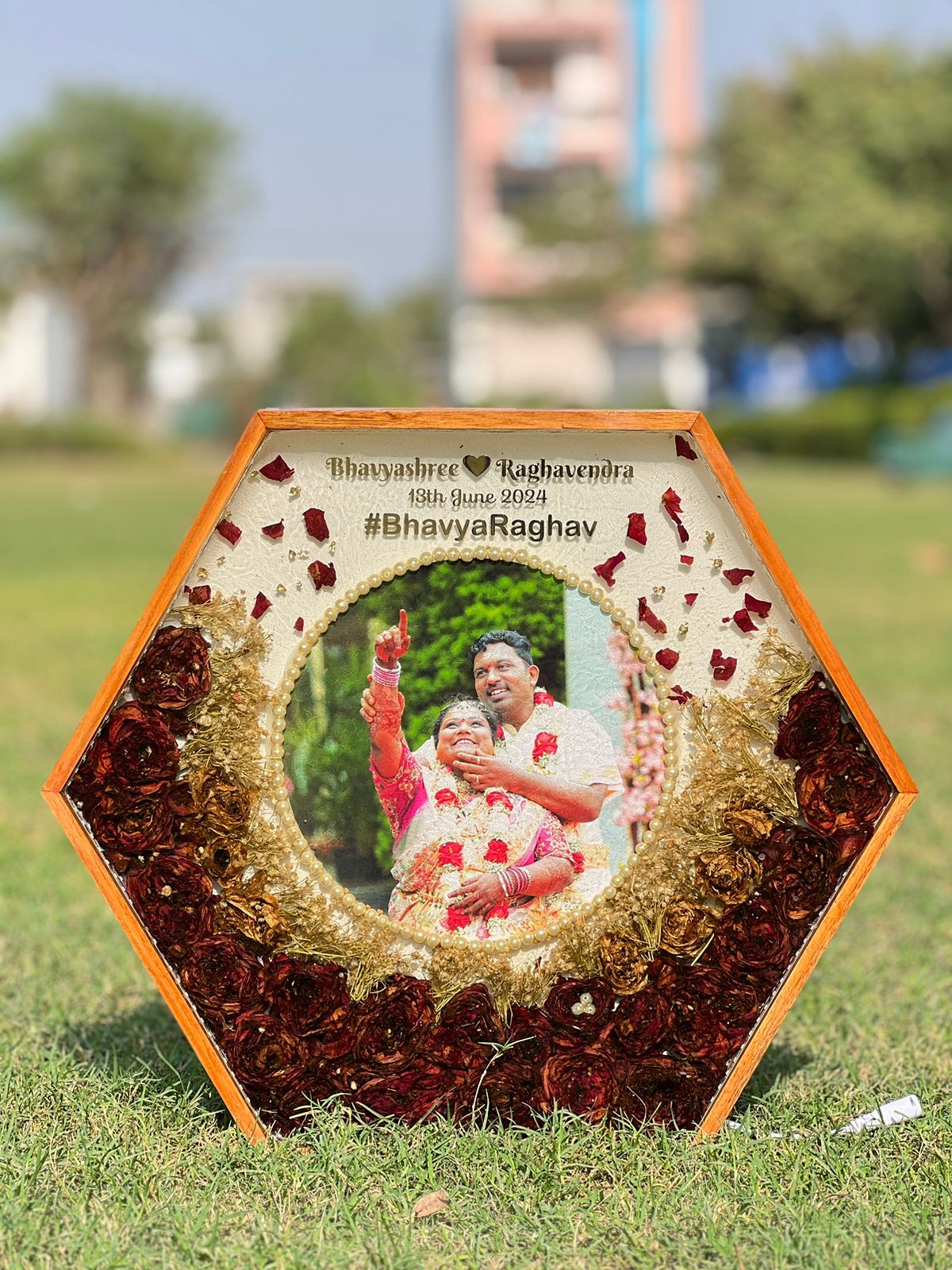 Hexagonal teakwood frame with wedding garland preservation
