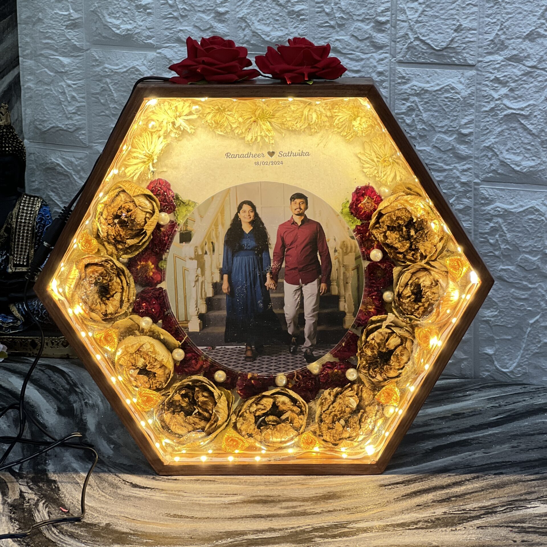 Hexagonal teakwood frame with varmala flower preservation
