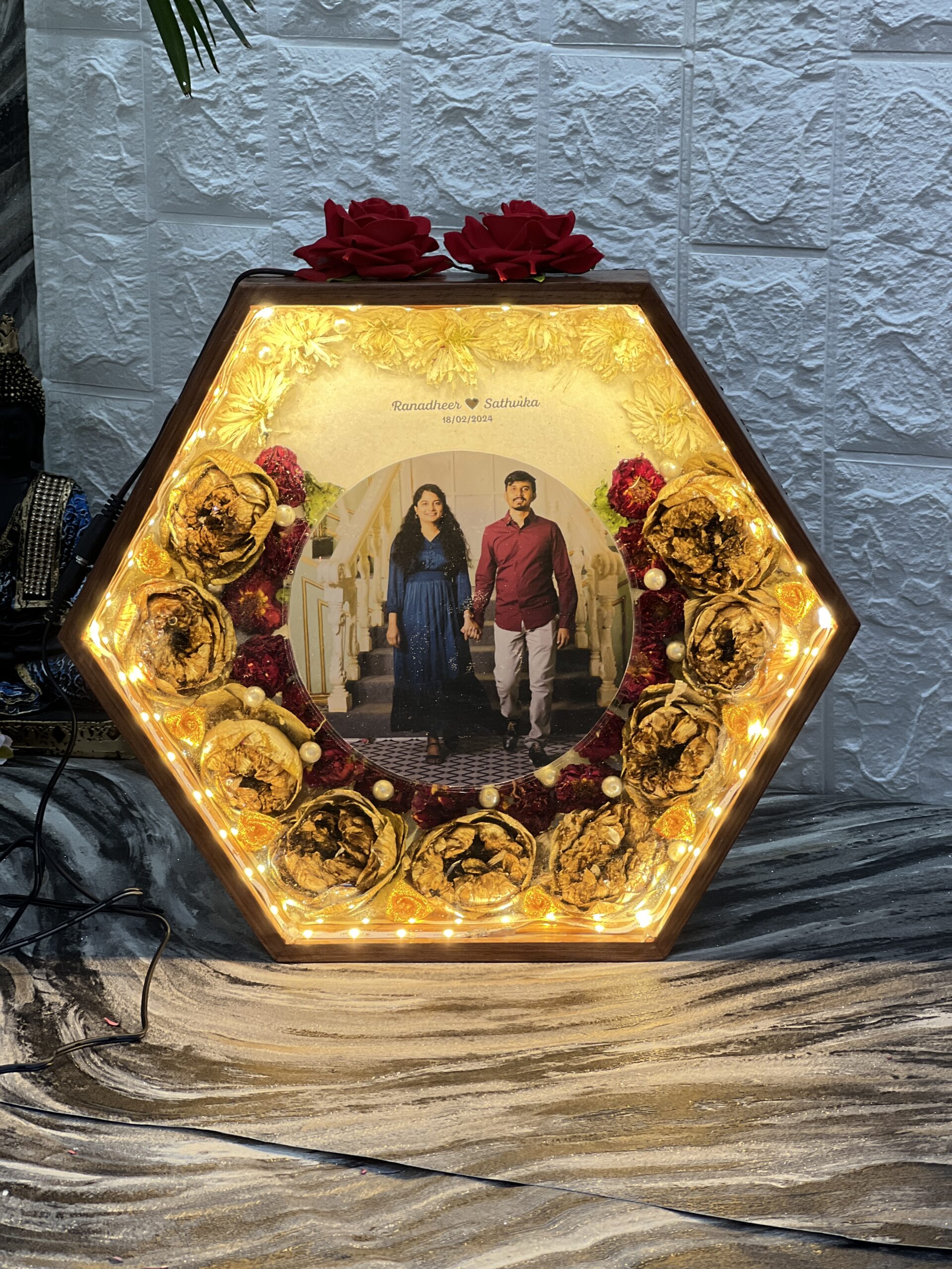 Hexagonal teakwood frame with varmala flower preservation