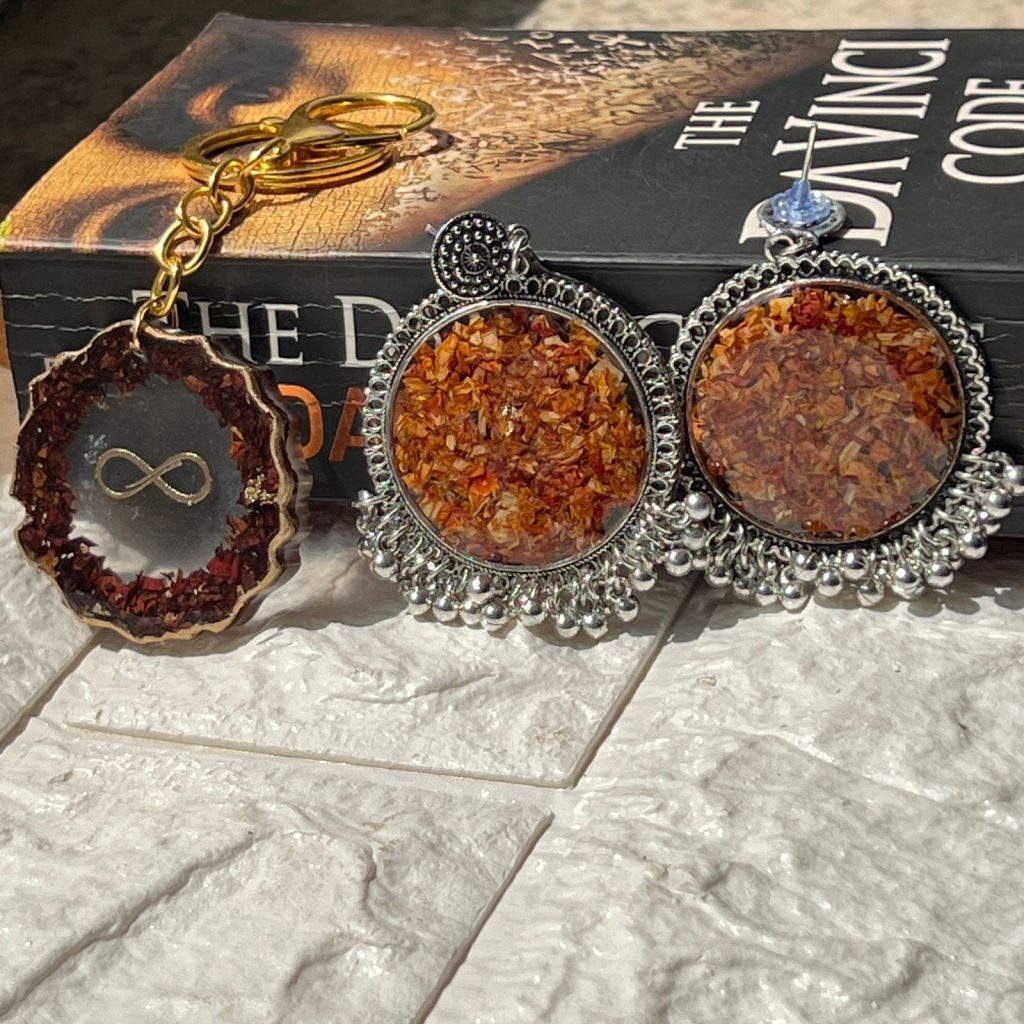 Epoxy resin jhumkas and keychain with infinity sign, preserved shaadi jaimala flowers