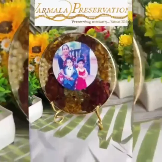 A finished round varmala frame with a couple photo