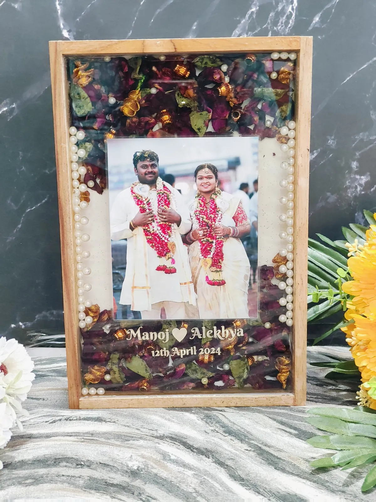 Wooden varmala frame with couple photo, names and date, made from a real wedding varmala at our Jaipur studio